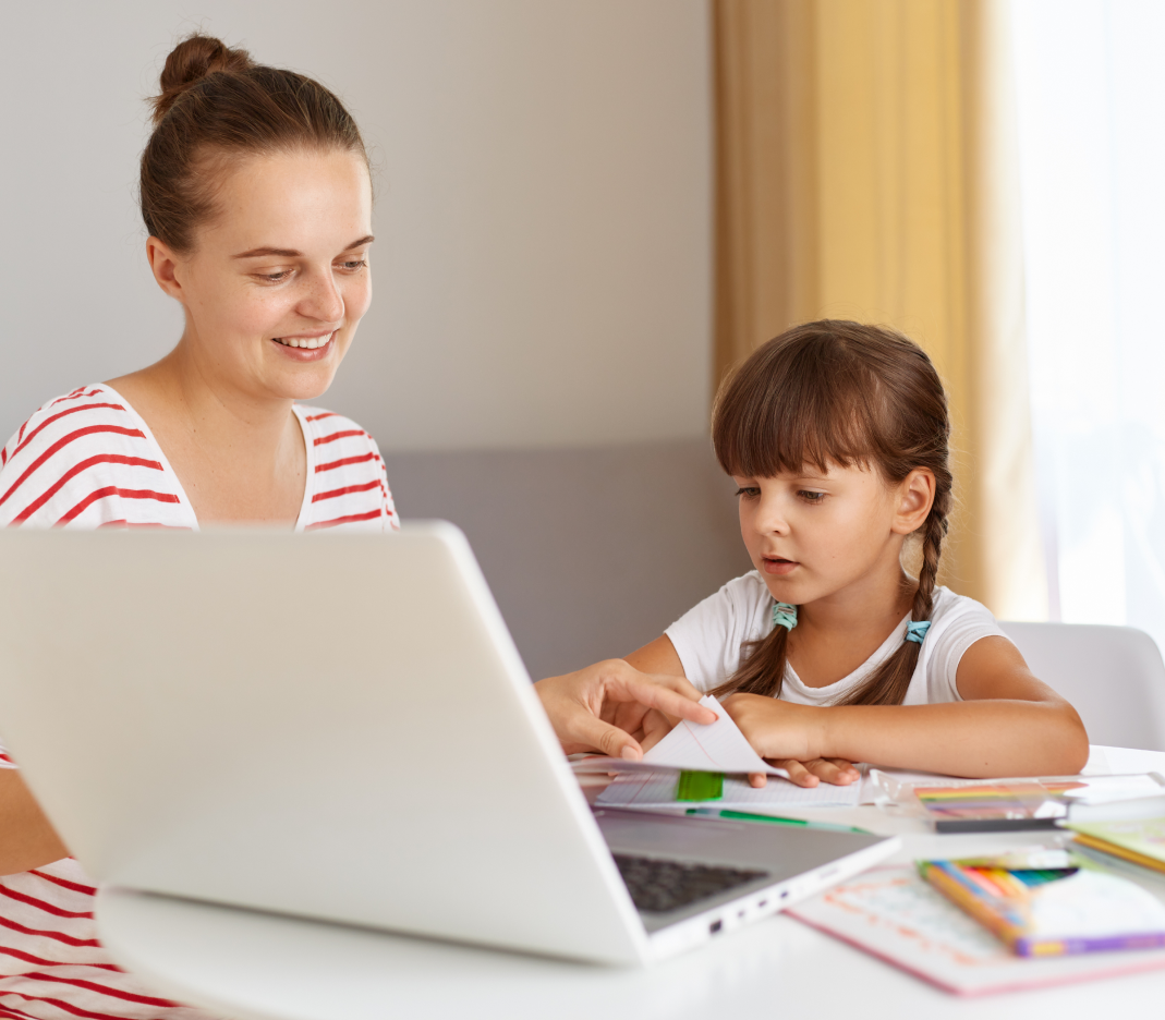 Girl with her mother solving math with laptop and text for grade 1 common core math overview displayed on right