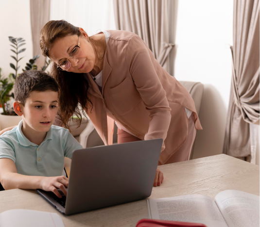 Female tutor standing near a boy looking at laptop and text for grade 6 common core math overview on right