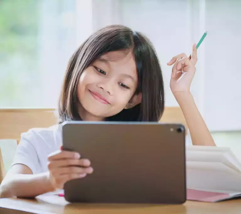 Close-up view of A Girl Taking Notes from Online Math Course on her Tablet Device with one Hand